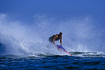 A man spinning a jet ski in the water.