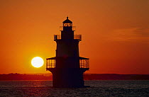 Silhouette of Hog Island Lighthouse at sunset, Bristol, Rhode Island, USA.