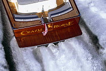 Close up of transom on motorboat "Crazy Horse" and the wake behind.