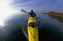 Photographer Onne Van Der Wal kayaking.