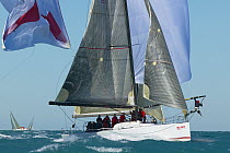 Bowman hanging on after losing the spinnaker during a spinnaker drop, Key West Race Week, Florida, 2005.