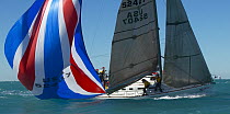 Spinnaker in the water tipping up the yacht during a spinnaker drop, Key West Race Week, Florida, 2005.