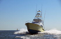 Sport fishing boat travelling at speed.