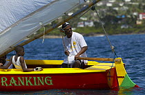 Locals racing a traditional boat during Grenada Sailing Festival 2005, Grenada, Caribbean.