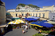 Small piazza with a cluster of shops, restaurants and cafes in the village of Anacapri, Capri, Bay of Naples, Italy.