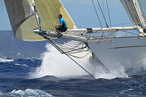 Schooner "Windrose" racing with bowman on the spinnaker pole at Antigua Classic Yacht Regatta 2005, Caribbean.