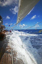 Water on the deck aboard the J-Class "Velsheda", Antigua Classic Yacht Regatta 2005, Caribbean. Model and Property Released.