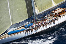 J-Class ^Ranger^ with the crew seated along the upside gunwale during Antigua Classic Yacht Regatta 2005, Caribbean.