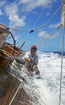 Crew trimming aboard J-Class "Velsheda" at Antigua Classic Yacht Regatta 2005, Caribbean. Model and Property Released.