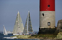 Yachts competing in the JPMorgan Round the Island Race with The Needles Lighthouse in the foreground, Isle of Wight, England, UK. 18th June 2005. ^^^Super-maxi "Maximus" took line honours finishing th...