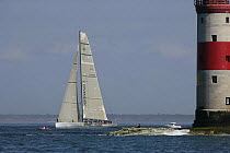 Super-maxi "Maximus" racing in the JPMorgan Round the Island Race, with The Needles Lighthouse in the foreground, Isle of Wight, England, UK, 18th June 2005. ^^^"Maximus" took line honours finishing t...