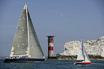Maxi-superyacht "Oystercatcher XXV" racing in the JPMorgan Round the Island Race, with The Needles Lighthouse in the background, Isle of Wight, England, UK, 18th June 2005. ^^^"Maximus" took line hono...