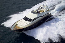 Luxury Tecnomar Nadara 88ft Fly motor cruiser cruising along the coast of Tuscany, near Viareggio, Italy.