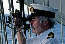 Second officer taking a sight using a sextant aboard Tall Ship "Sea Cloud".