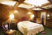 Luxurious master bedroom aboard tall ship "Sea Cloud".
