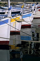 Traditional pointu fishing boats moored in the old port of Cassis, France