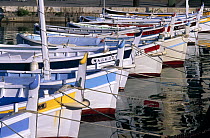 Traditional pointu fishing boats moored in the old port of Cassis, France