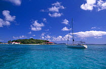Yacht cruising the coast of Marina Cay, British Virgin Islands (BVI)