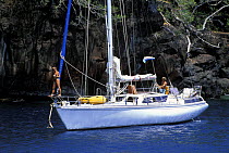 A cruising yacht in a Mediterranean cove.