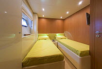 Twin bedroom aboard a Continential 80 motor yacht, designed and built at Cantieri CNM. Cannes, France.