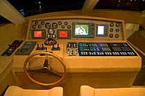 Steering wheel and cockpit aboard a Continential 80 motor yacht designed and built at Cantieri CNM. Cannes, France.