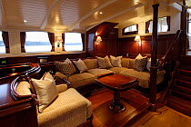Seating with views in the main deck house area on board 180ft ketch "Adele". ^^^The 180-foot luxury ketch was designed by Andre Hoek and built by the famous Vitters Shipyard in Holland. It is owned by...