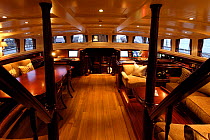 A large table, views and seating can all be found in the main deck house area on board 180ft ketch "Adele". ^^^The 180-foot luxury ketch was designed by Andre Hoek and built by the famous Vitters Ship...