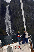 Superyacht "Adele" exploring the Norwegian Fjords in the Sognefjorde area, during week 25 of her maiden voyage. ^^^ A waterfall forms a beautiful backdrop to Owner Jan-Eric Osterlund and his guests on...
