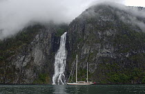 180ft Superyacht "Adele" exploring the Norwegian Fjords in the Sognefjorde area, during week 25 of her maiden voyage. A waterfall and low cloud form a dramatic backdrop. ^^^ Adele is a 180-foot Andre...