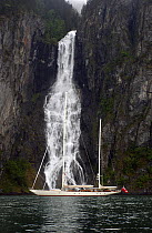 180ft Superyacht "Adele" exploring the Norwegian Fjords in the Sognefjorde area, during week 25 of her maiden voyage. A waterfall forms a dramatic backdrop.^^^ Adele is a 180-foot Andre Hoek designed...