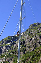 Guests enjoy spectacular mountain views from the crow's nest of the Superyacht "Adele". The crow's nest can be hoisted and lowered by a hydraulic captive winch. It reaches 40 metres above the waterlin...