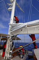 Crew prepare the sails aboard the superyacht "Adele".