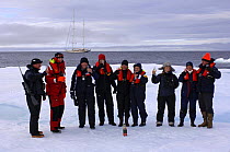 Members of the crew and guests from superyacht "Adele" explore the frozen waters of Spitsbergen (also know as Svalbard) in Norway. ^^^ They even have Champagne on ice! The yacht can be seen in the ba...
