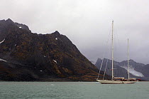 Superyacht "Adele" carefully makes her way along the scenic coast of Spitsbergen (also know as Svalbard) in Norway, during her maiden voyage in 2005. ^^^  A glacier can be seen flowing down to the w...