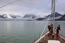Superyacht "Adele" makes her way along the mountain coast of Spitsbergen (also know as Svalbard) in Norway, during her maiden voyage in 2005. ^^^ Adele is 180 foot Andre Hoek design, built by Vitters...