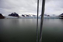 Superyacht "Adele" makes her way along the spectacular mountain coast of Spitsbergen (also know as Svalbard) in Norway, during her maiden voyage in 2005. ^^^ Adele is 180 foot Andre Hoek design, buil...