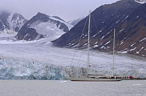 Superyacht "Adele" alongside a wall of ice that clings to the mountainous coasts of Spitsbergen, Norway. ^^^ Adele is 180 foot Andre Hoek design, built by Vitters Shipyard, Holland, and owned by Jan-E...