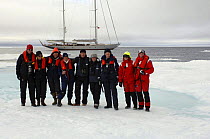 Crew and guests from Superyacht "Adele" explore the frozen waters of Spitsbergen (also know as Svalbard) in Norway. ^^^ The yacht can be seen in the background. She is 180 foot Andre Hoek design, bui...