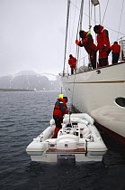 Tender is lowered into the water from superyacht "Adele", during her maiden cruise to Spitsbergen (also known as Svalbard) in Norway.^^^ Adele's owner Jan-Eric Osterlund designed the yacht to cruise r...