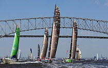 Fleet of racing yachts passes under Francis Scott Key Bridge prior to the start of leg 7 of the Volvo Ocean Race from Baltimore to Annapolis USA on Sunday April 28, 2001-2002.