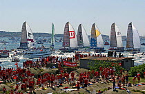 Assa Abloy supporters take over an island as the fleet passes at the restart in Gothenburg Sweden during a leg of the Volvo Ocean Race - June 8, 2002.