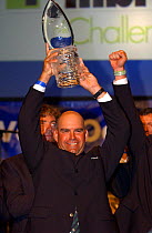 Volvo Ocean Race Prize Giving in Kiel Sweden. John Kostecki of "Illbruck Challenge" lifts the Fighting Finish Trophy for first overall in the Volvo Ocean Race 2001-2002.