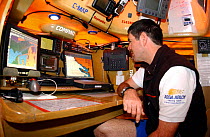 Assa Abloy navigator, Mark Rudiger runs through the navigation programs prior to the start of Leg 8 of the Volvo Ocean Raxe La Rochelle France - Gothenburg Sweden, 2001-2002.
