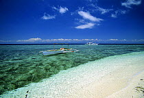 Two "Bancas", typical fishing boats of this area, in clear the waters of Balicasag Island (Bohol), Philippines.
