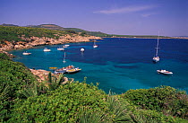 Boats anchored in Cala dell' Ollandese, Alghero, Sardinia, Italy.