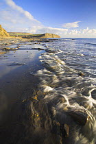 Sea washing up onto the shore at Kimmeridge, Dorset. Jurassic Coast World Heritage Site. December 2005.