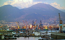 The port town of Naples at sunset, with Vesuvius behind. Campania, Italy.