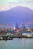 The port town of Naples at sunset, with Vesuvius behind. Campania, Italy.