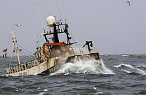 MFV "Demares" heaving up trawl warps in moderate sea swells on the North Sea. October 2006.