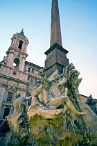 Bernini's Fontana dei 4 fiumi (fountain of the four rivers) in Rome's Piazza Navona. In this picture is a statue representing the Ganges River and the continent of Asia. In the background is the churc...